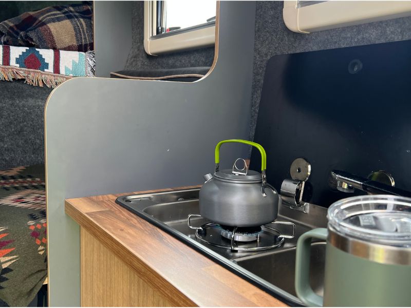 Gas hob with kettle on