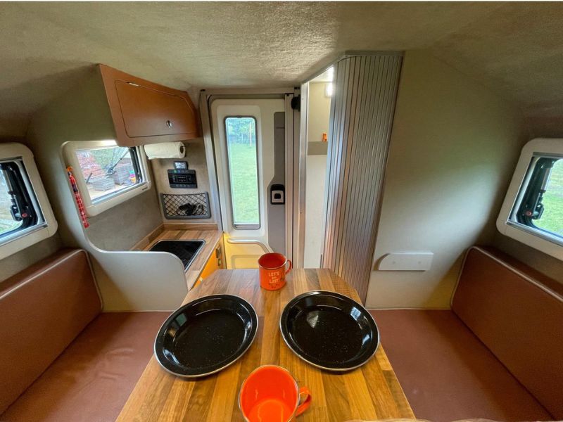 Seating area, kitchen area, bathroom and backdoor