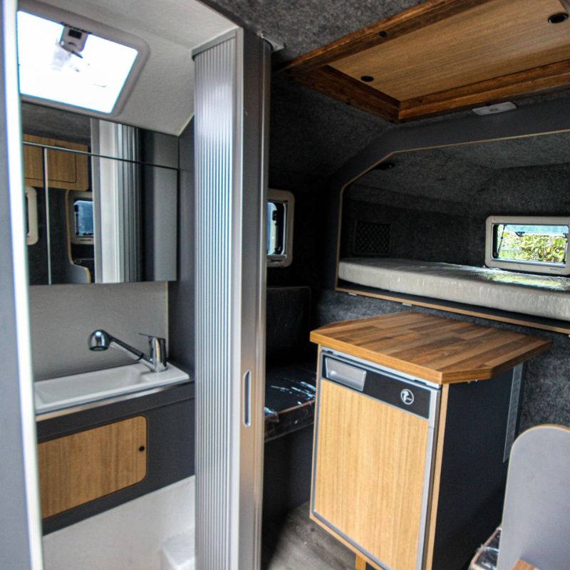 Bathroom, sitting area and bed