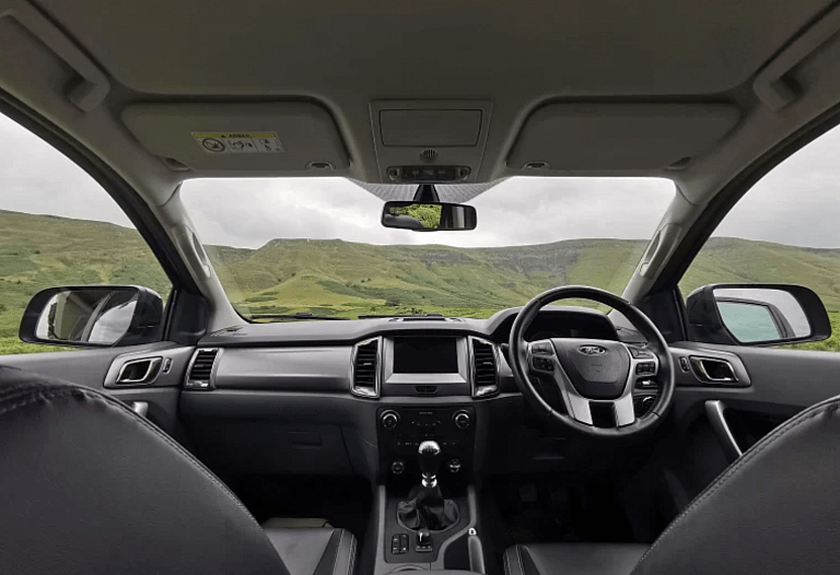 Inside a Wild Camper Truck looking out to the mountains